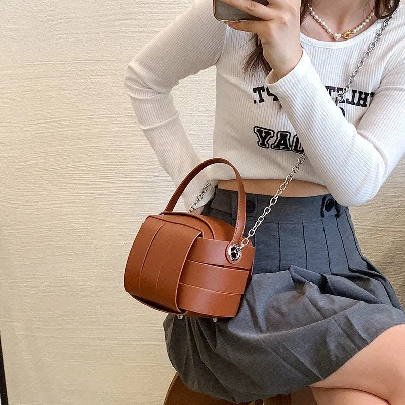 Women's PU leather vintage spliced crossbody handbag in black with magnetic buckle closure, 14cm size