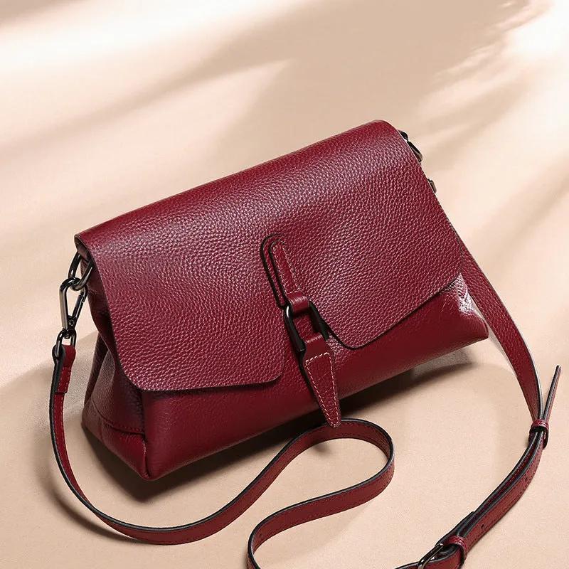 Women's soft first layer cowhide shoulder bag in black with adjustable strap and multiple pockets