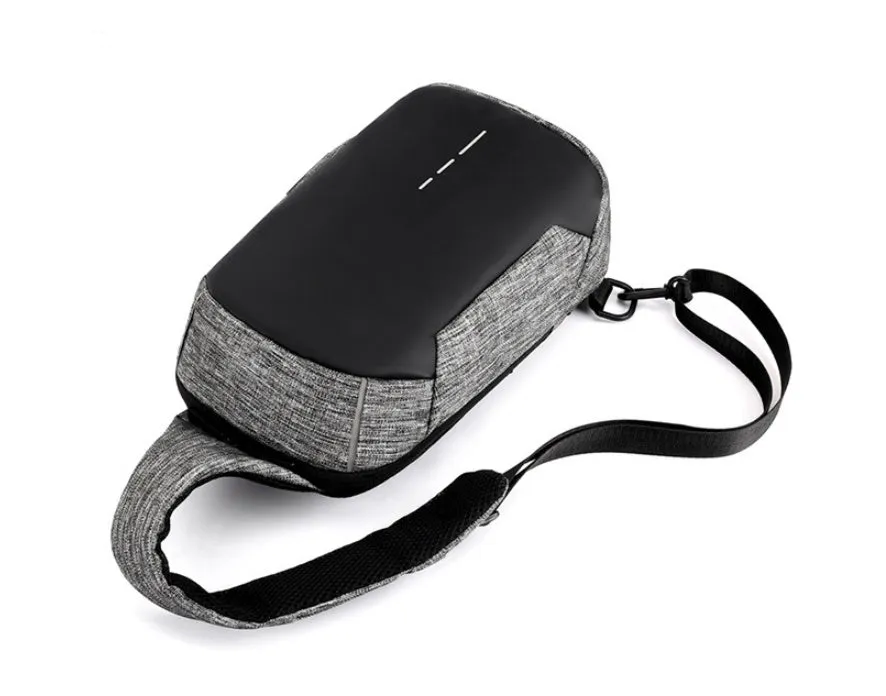 Small dark blue oxford cloth chest bag with a zipper and adjustable strap, showing internal phone pocket.