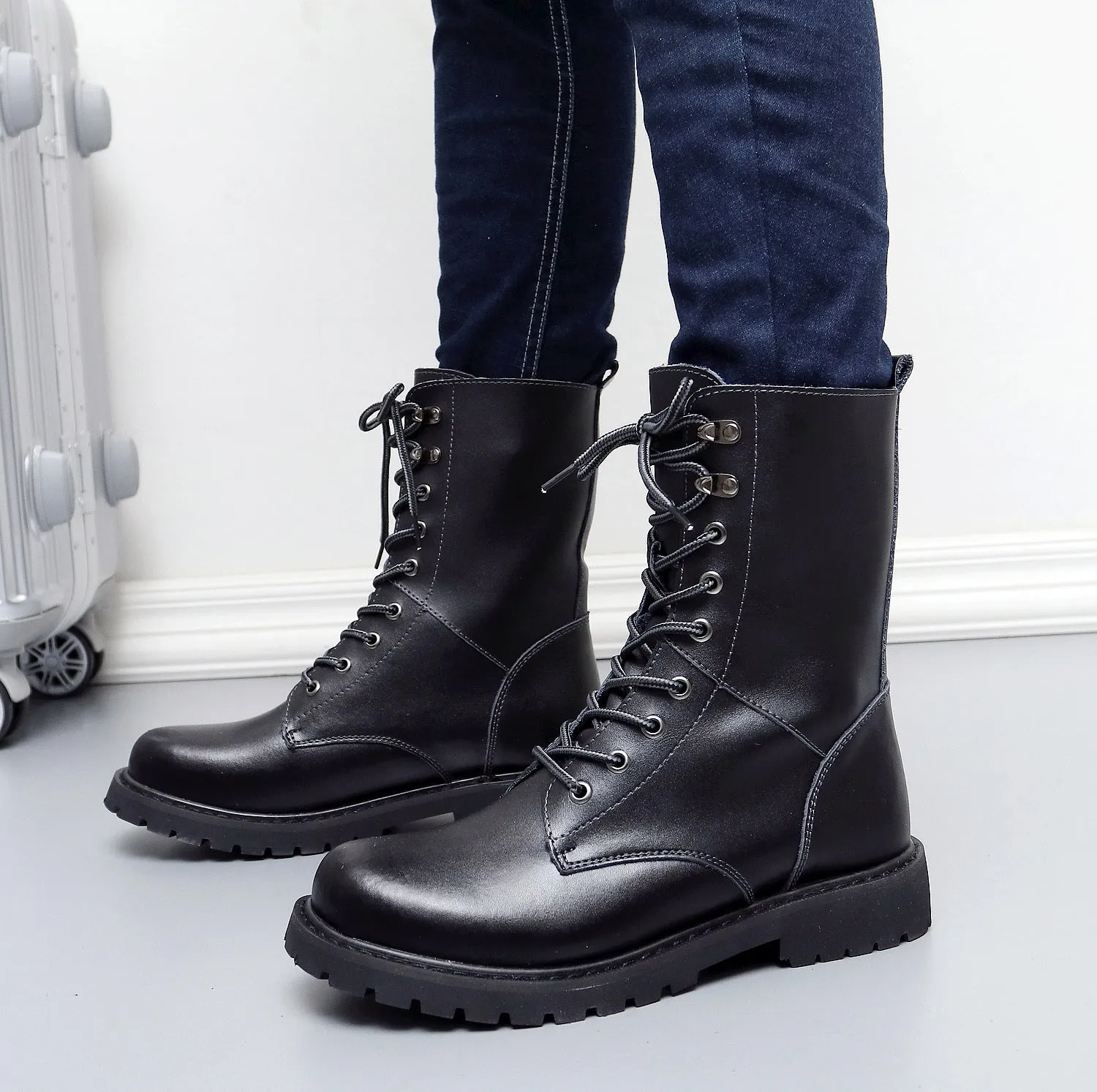 Men's leather military high top boots with fleece lining, black, side view showing front tie closure and square heel