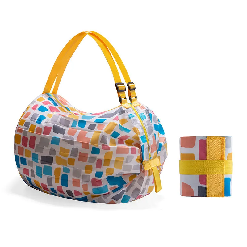 Large capacity foldable nylon shopping bag in beige yellow, open and full with groceries