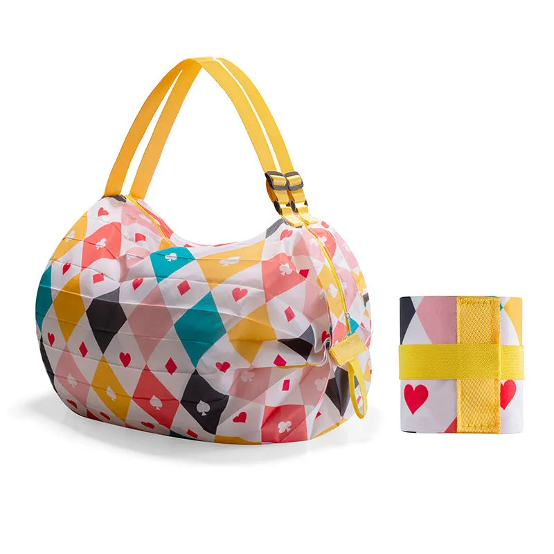 Large capacity foldable nylon shopping bag in beige yellow, open and full with groceries