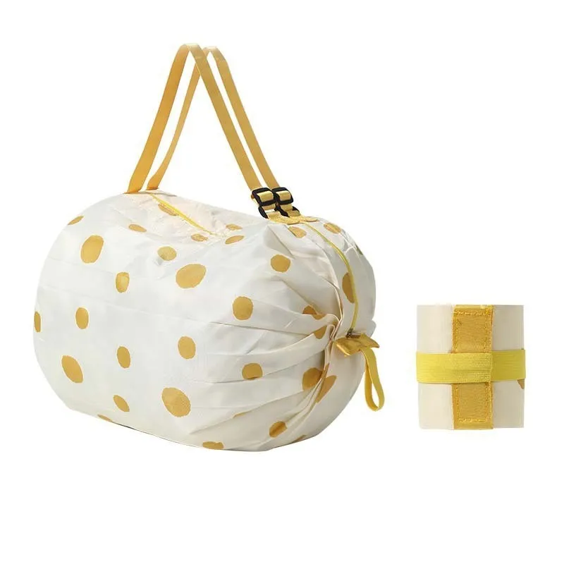 Large capacity foldable nylon shopping bag in beige yellow, open and full with groceries