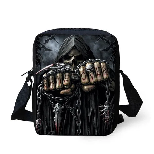 A medium-sized black children's messenger bag with a white skull print, showing double shoulder straps and a front zipper pocket.