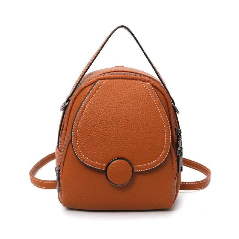 Fashion mini backpack in PU leather, compact 20x23x8 cm size, available in black and brown, with soft handle and zippered interior