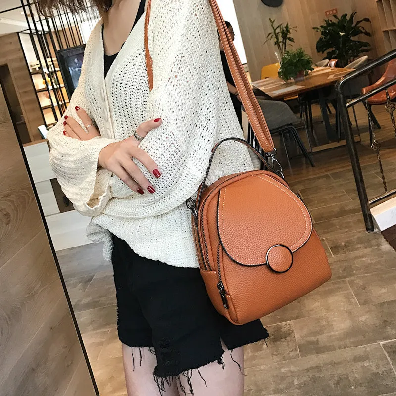 Fashion mini backpack in PU leather, compact 20x23x8 cm size, available in black and brown, with soft handle and zippered interior