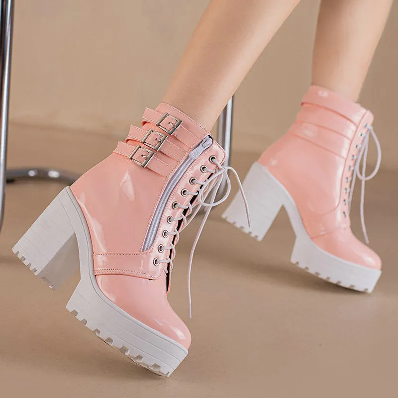 Women's black thick-heeled short boots with lace-up front and round toe on a rubber sole.