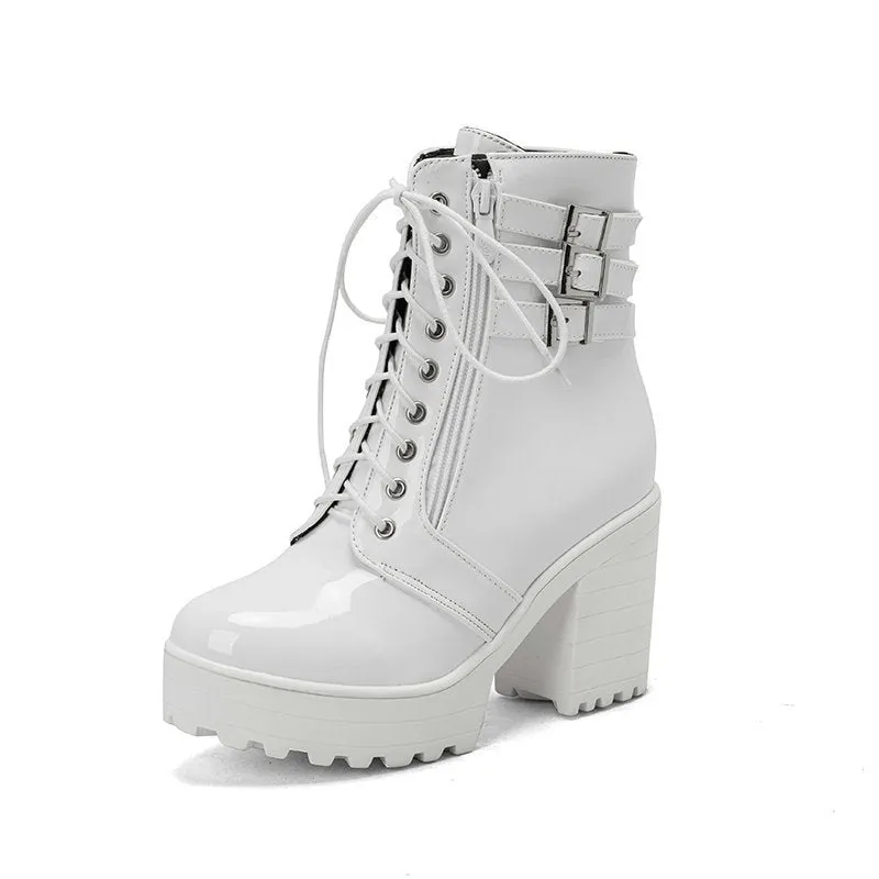Women's black thick-heeled short boots with lace-up front and round toe on a rubber sole.