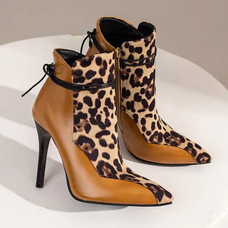 Women's pointed toe knight boots with 11cm stiletto heel, low tube ankle, and side zipper in black, brown, and white