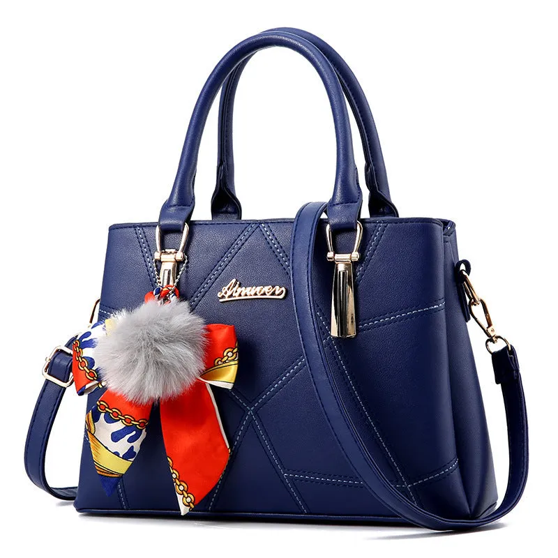 Women's cross section square PU messenger bag with embroidery in royal blue colour showing soft handle and single shoulder strap
