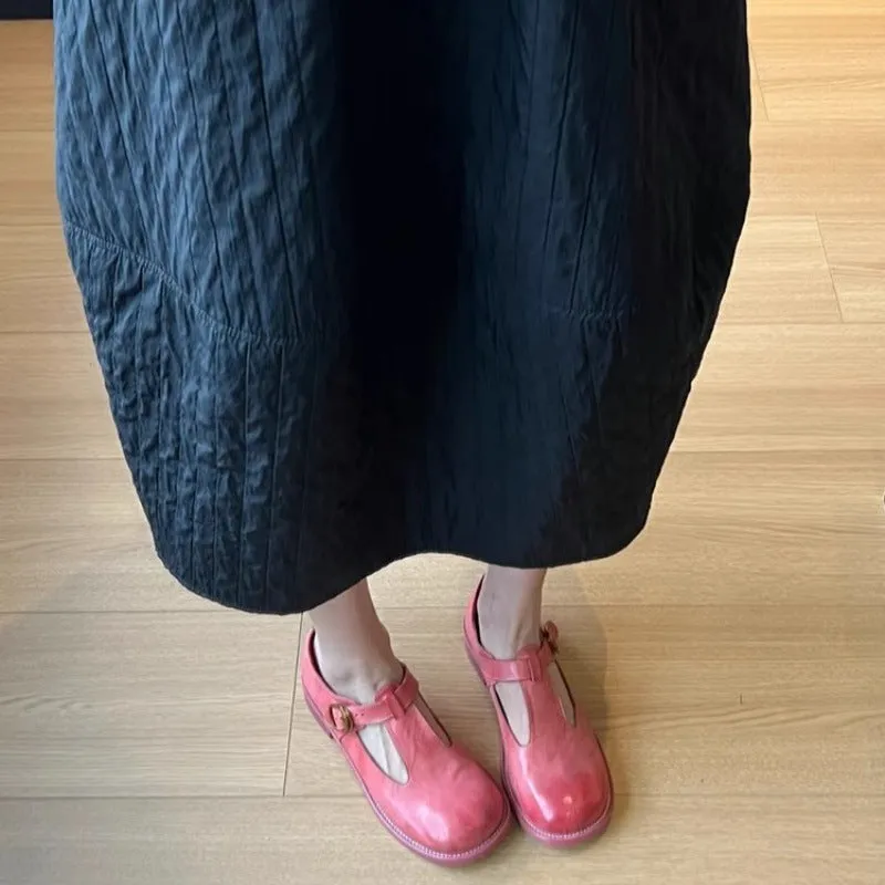 Women's retro round toe pumps in pink brush colour with low heel and buckle closure