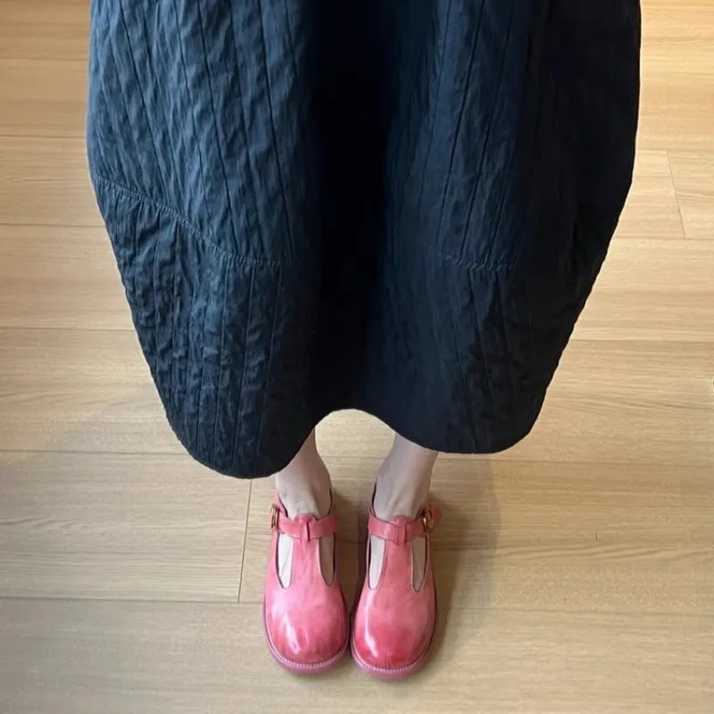 Women's retro round toe pumps in pink brush colour with low heel and buckle closure
