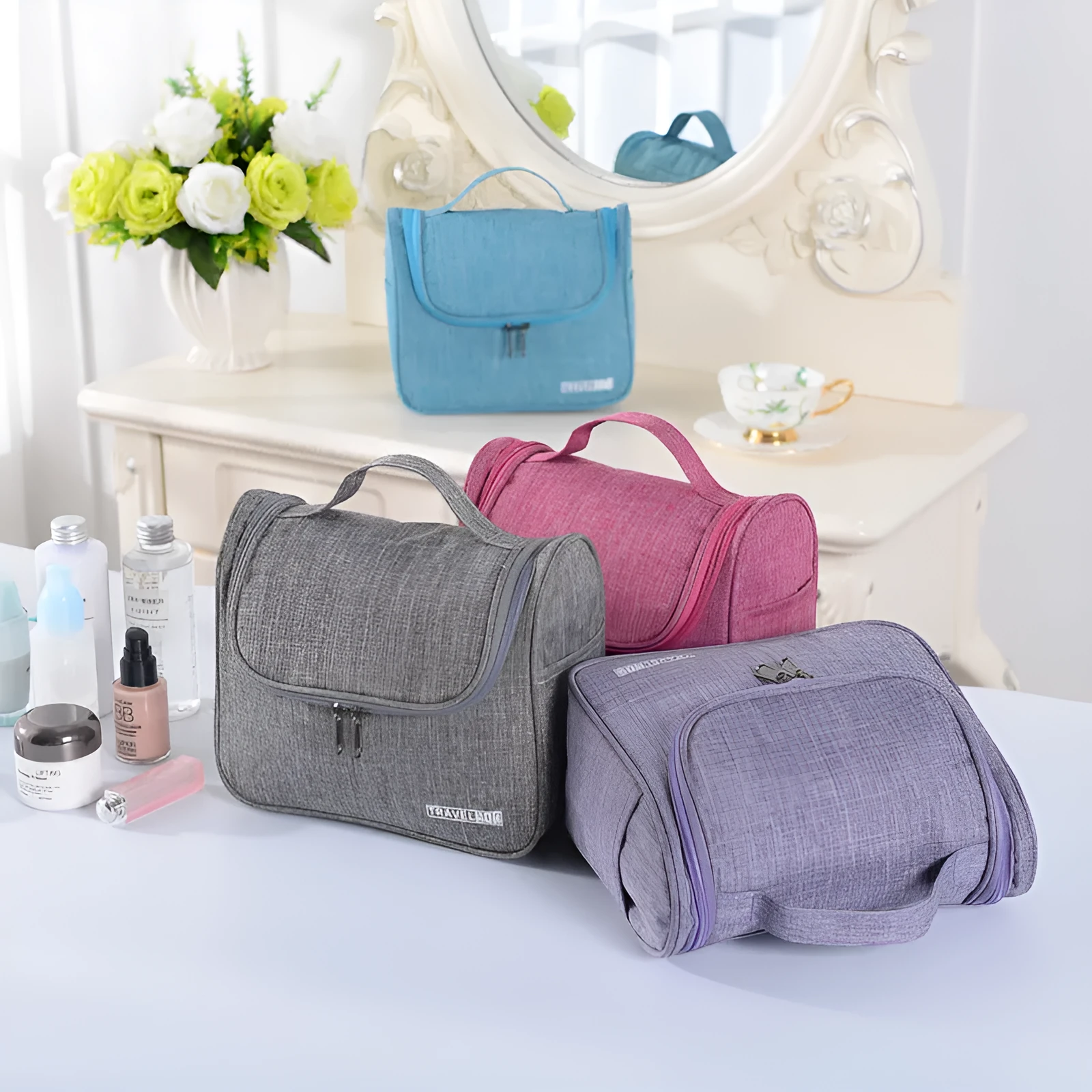 Cube-shaped cationic toiletry bag in black, folded open to show interior storage space
