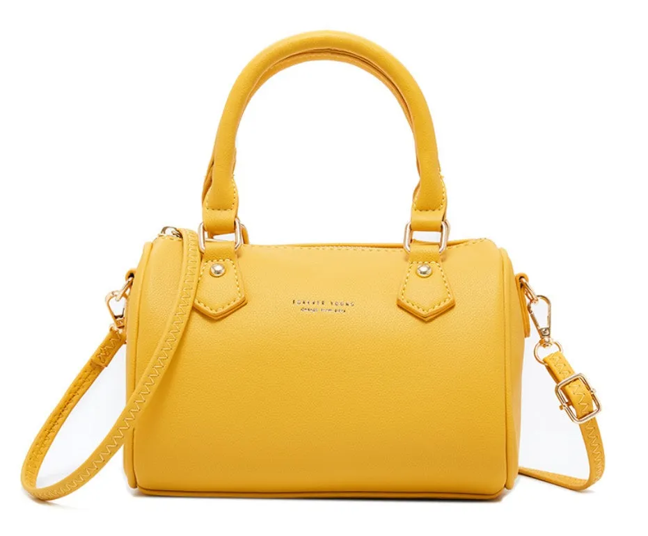Ladies diagonal pillow crossbody bag in PU fabric with letter print in yellow colour