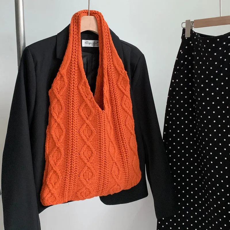 Retro hollow knitted wool yarn women's shoulder tote bag in a solid colour with double straps.