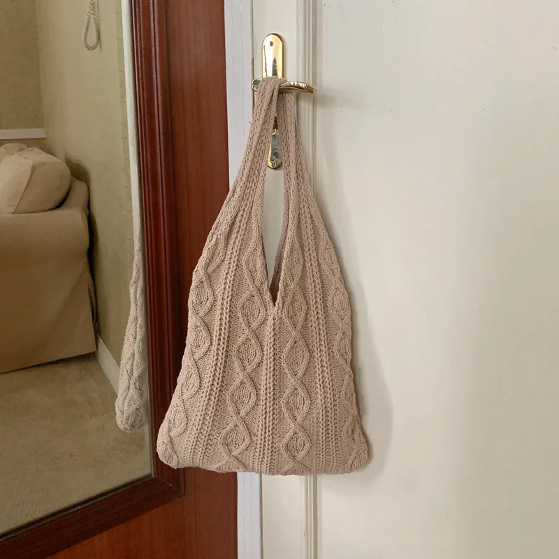 Retro hollow knitted wool yarn women's shoulder tote bag in a solid colour with double straps.