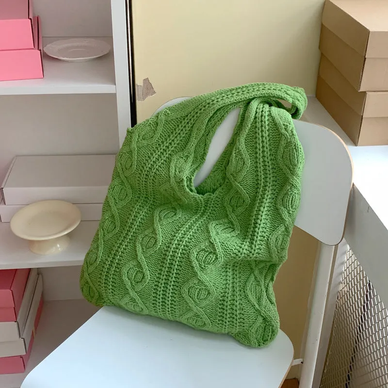 Retro hollow knitted wool yarn women's shoulder tote bag in a solid colour with double straps.