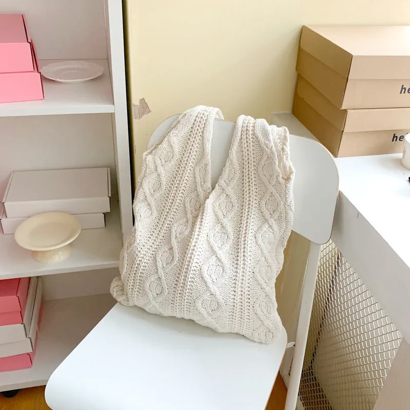 Retro hollow knitted wool yarn women's shoulder tote bag in a solid colour with double straps.
