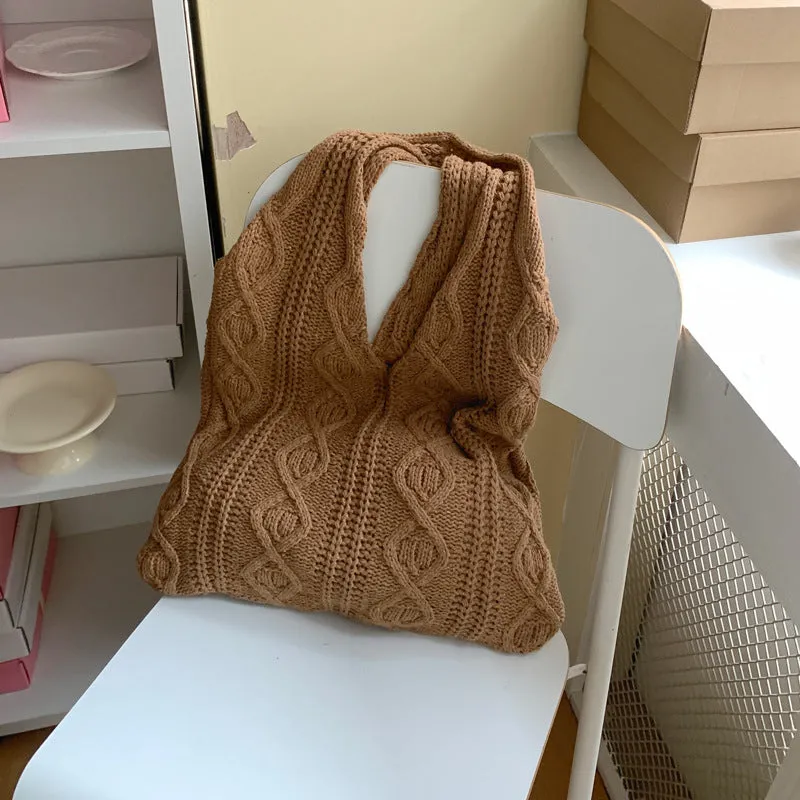 Retro hollow knitted wool yarn women's shoulder tote bag in a solid colour with double straps.