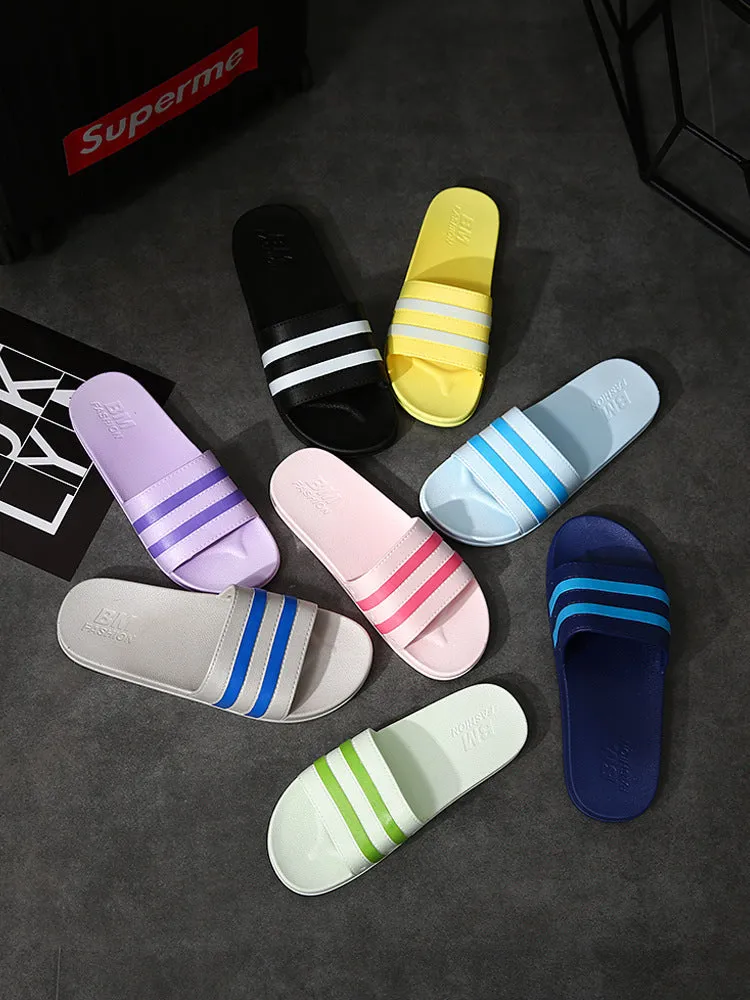 Striped PVC bath slippers for men and women in white with injection-moulded sole, side view
