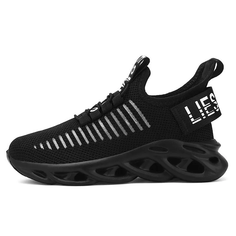 Children's black sneakers with Velcro strap, fabric upper, and patterned EVA sole.