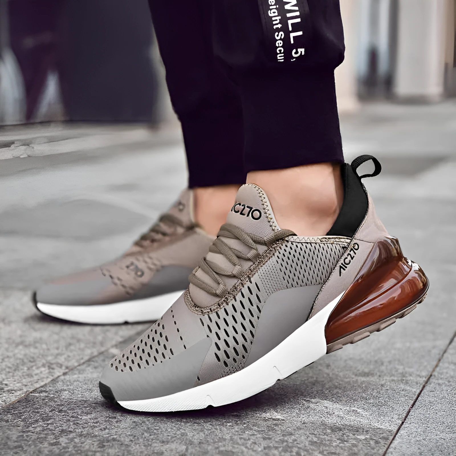 Men's mesh casual shoe with front strap, rubber sole, colour-blocked upper in black and red