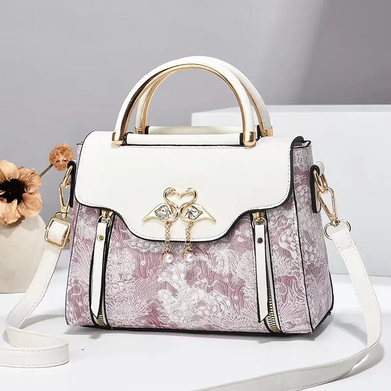 Women's PU crossbody bag in black with woven texture, horizontal square shape, and single shoulder strap