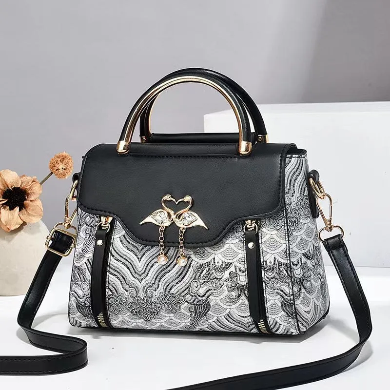 Women's PU crossbody bag in black with woven texture, horizontal square shape, and single shoulder strap