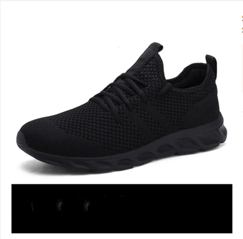 Men's black and white lace-up casual sneaker with mesh upper on a PVC sole.