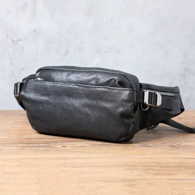 Men's small black head layer cowhide cross-body backpack with zip closure and single shoulder strap