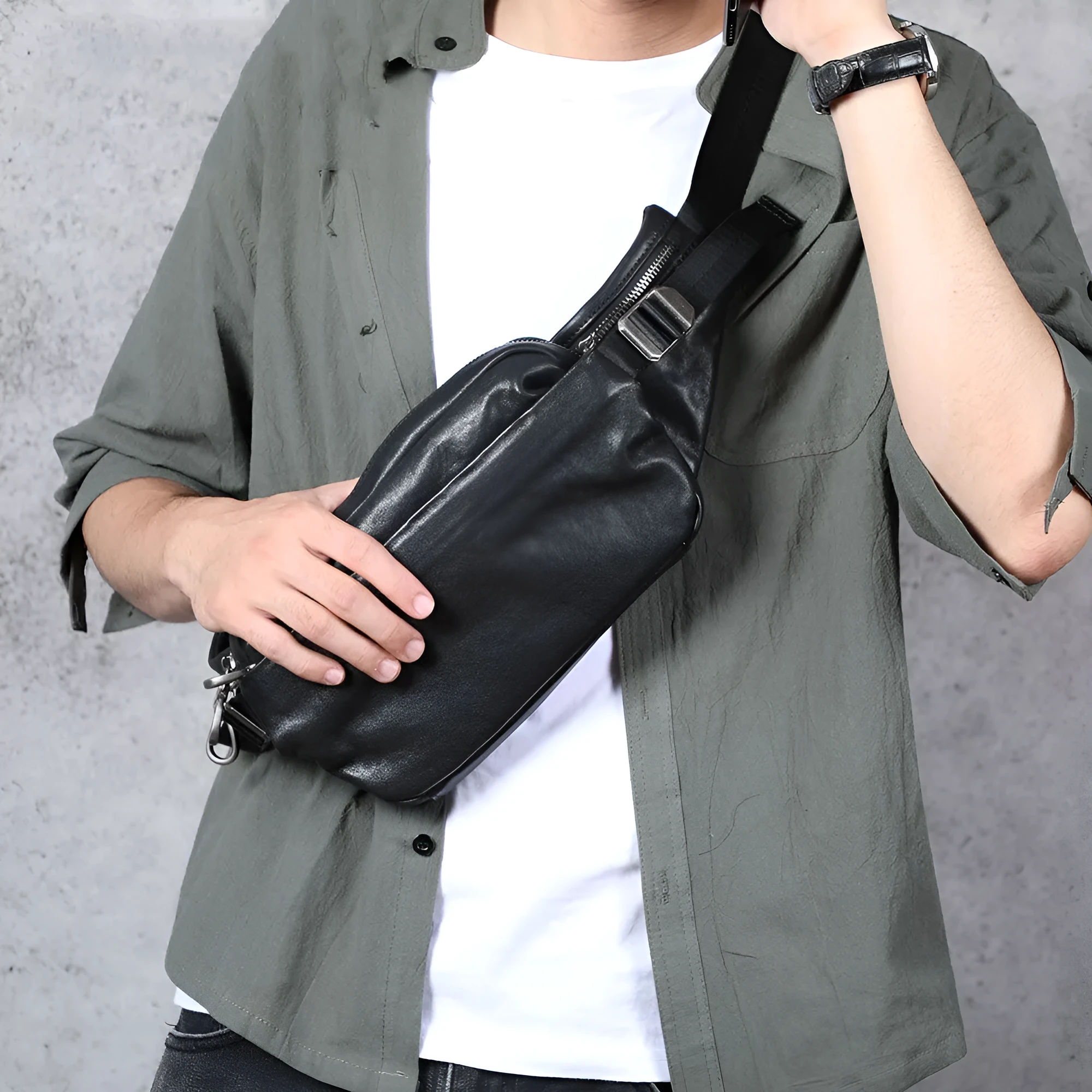 Men's small black head layer cowhide cross-body backpack with zip closure and single shoulder strap