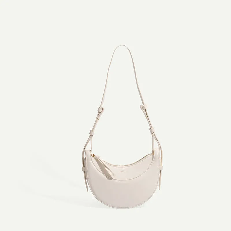 Women's crescent shoulder bag with litchi pattern texture, available in camel, black, chalk white, and elephant gray