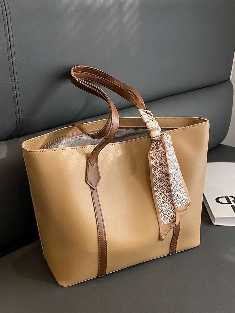 Soft large tote shoulder bag with crossbody strap in multiple colour options including black, khaki, and white with coloured trim