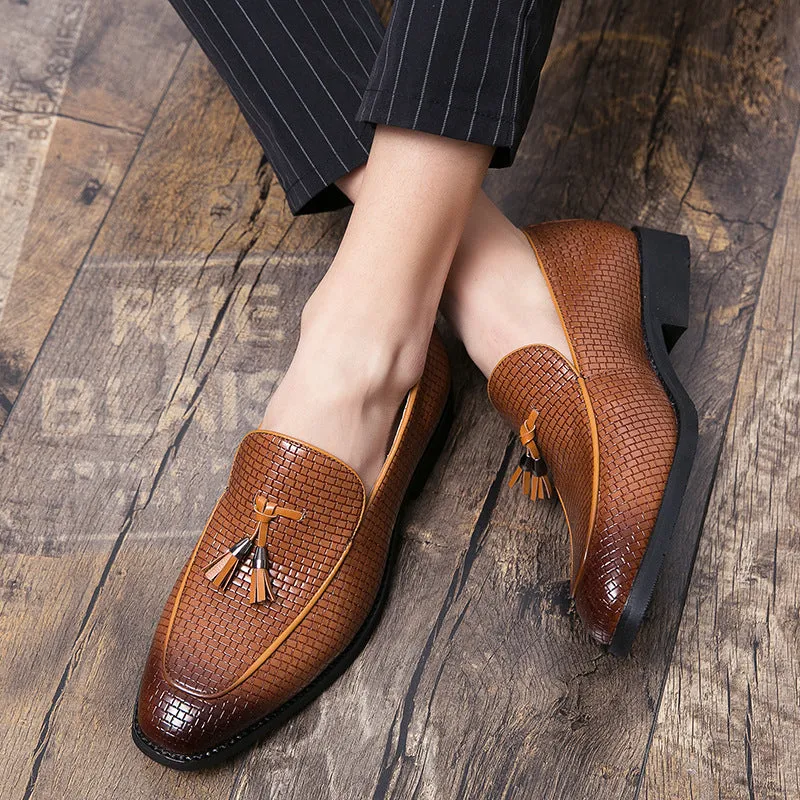 Men's black formal slip-on shoe with pointed toe and decorative tassel on artificial PU upper.