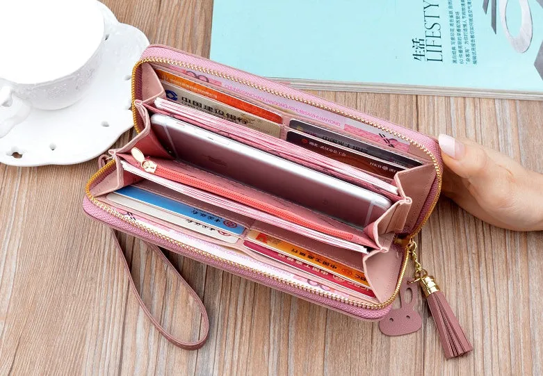 Women's long zip wallet in black PU leather with zipper closure and compact dimensions