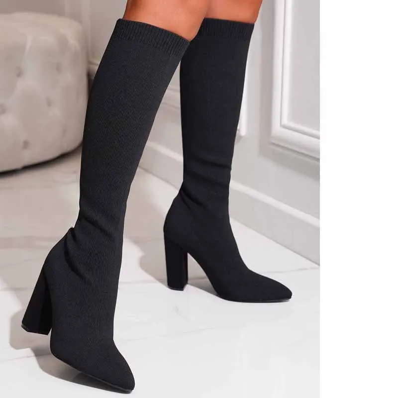 Women's thick high-heel thigh boots in solid black colour with PU upper and super high heel above 8cm