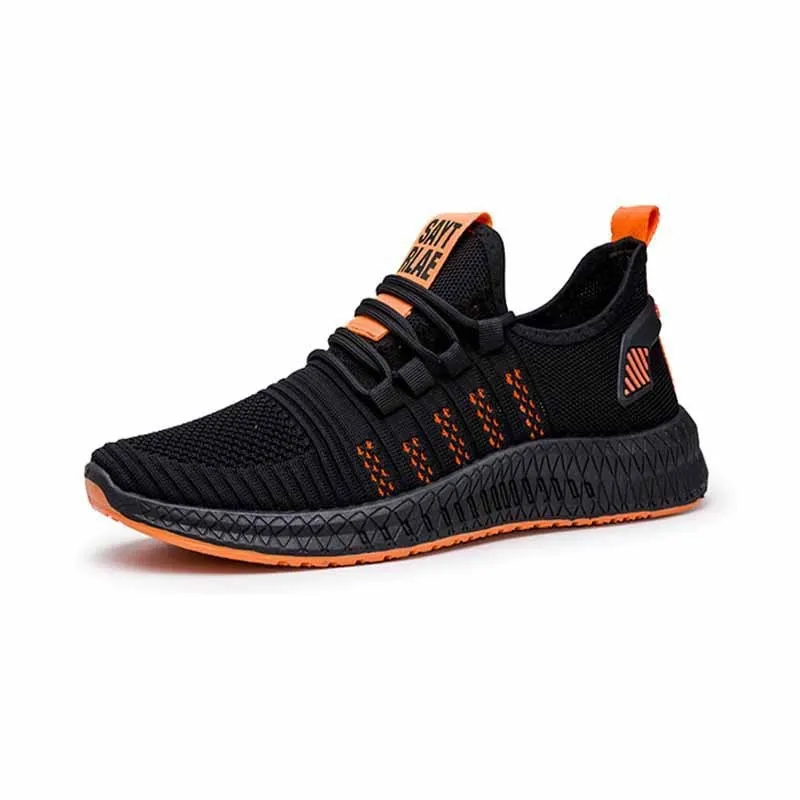 Men's low-top black casual trainers with cross-strap detail and flying weave upper, shown on a white background.