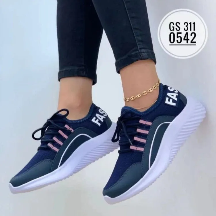 Women's lace up mesh sneakers in pink with cross strap design, round toe, rubber sole, medium heel