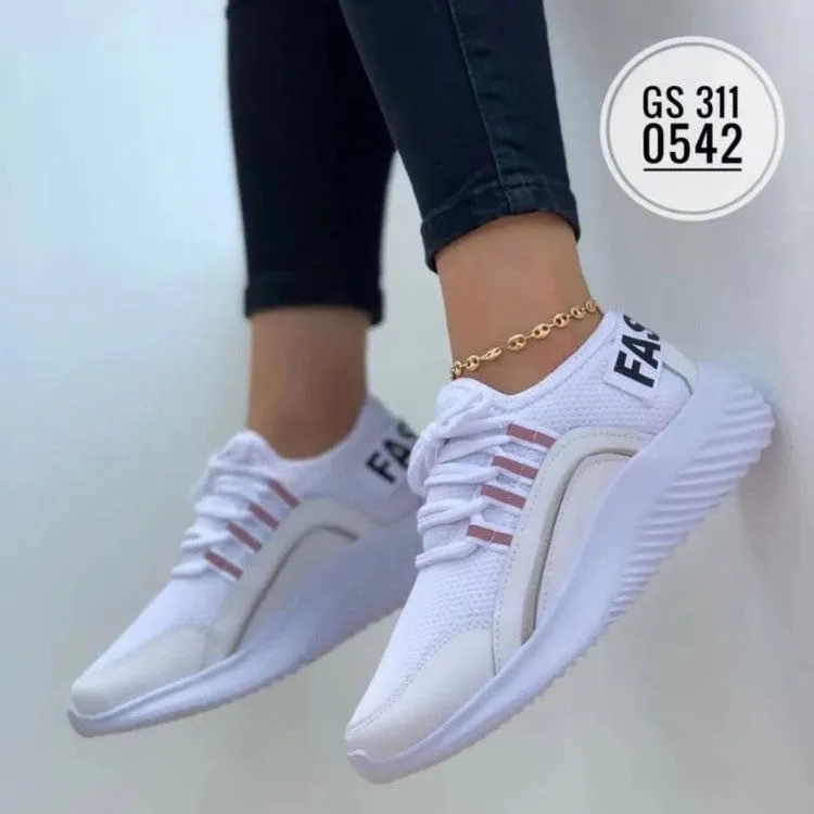 Women's lace up mesh sneakers in pink with cross strap design, round toe, rubber sole, medium heel
