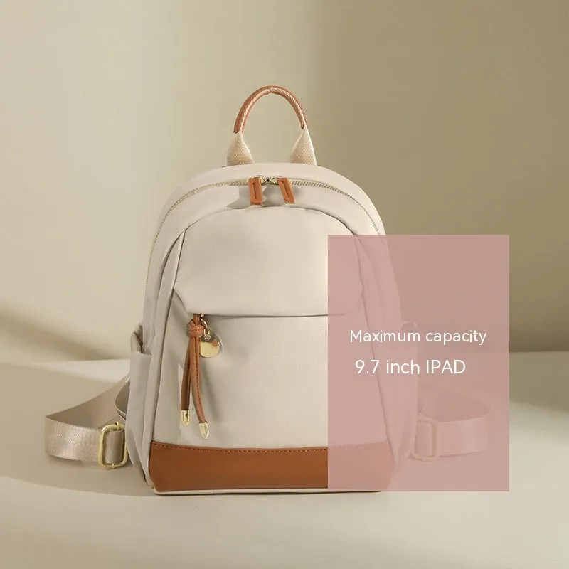 Women's double shoulder Oxford cloth backpack in almond colour with contrast stitching and open outer pocket