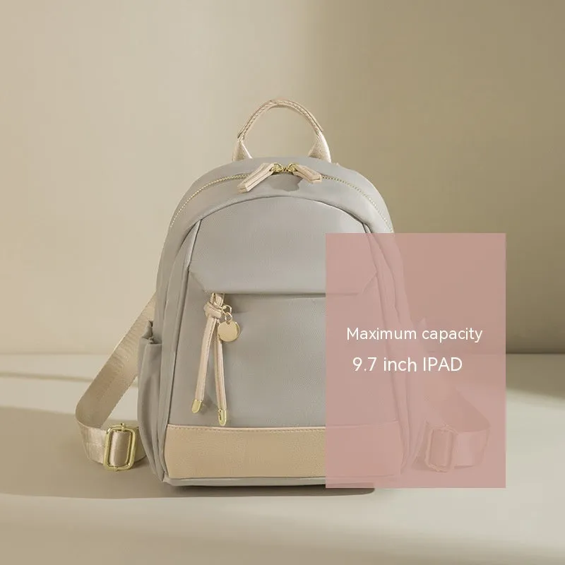 Women's double shoulder Oxford cloth backpack in almond colour with contrast stitching and open outer pocket