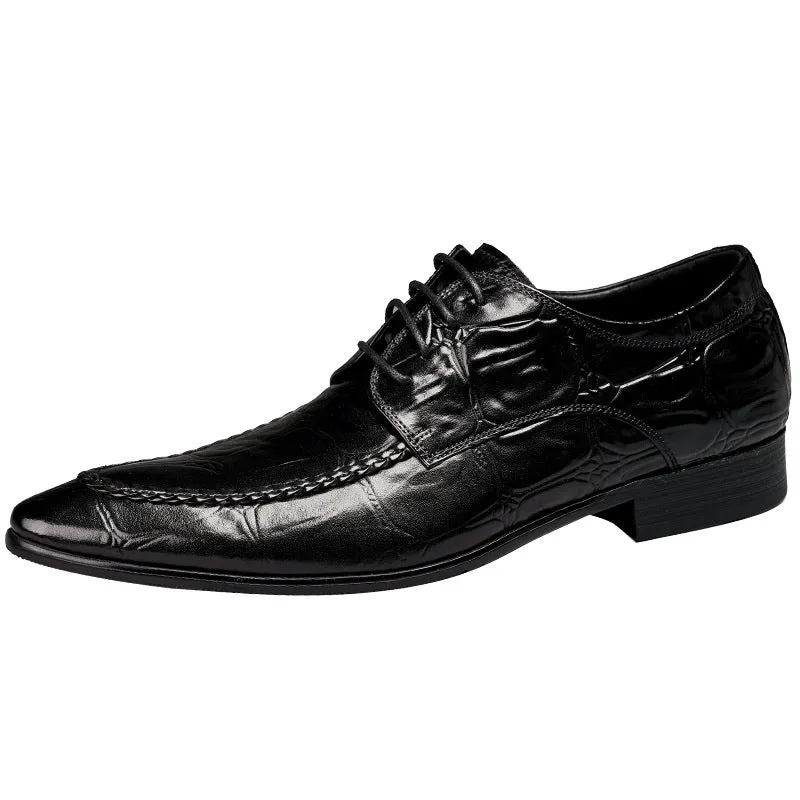 Men's black leather oxford shoes with a horse bit buckle and pointed toe on a rubber sole.