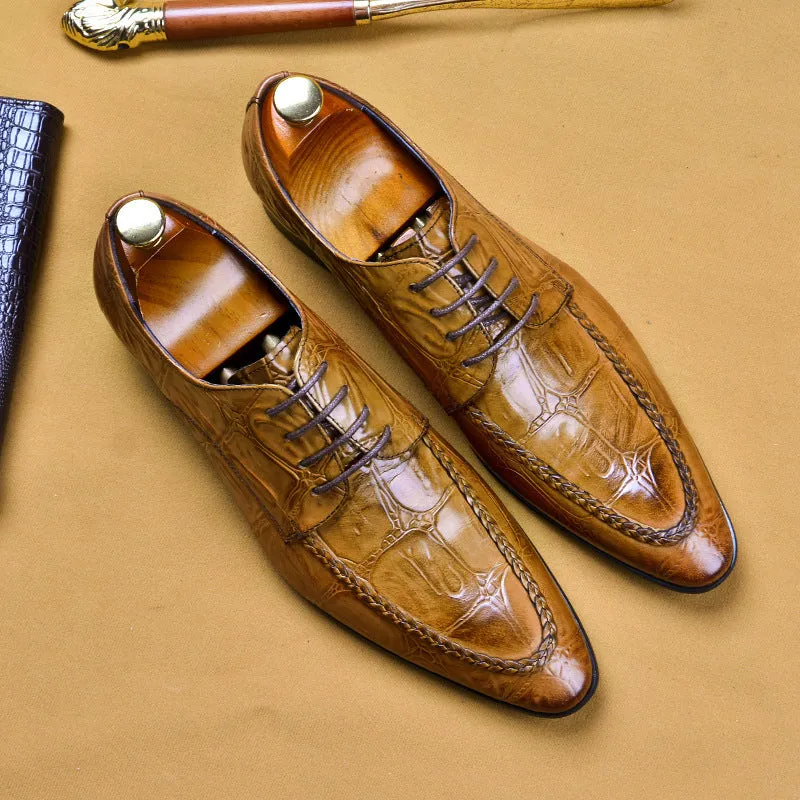 Men's black leather oxford shoes with a horse bit buckle and pointed toe on a rubber sole.
