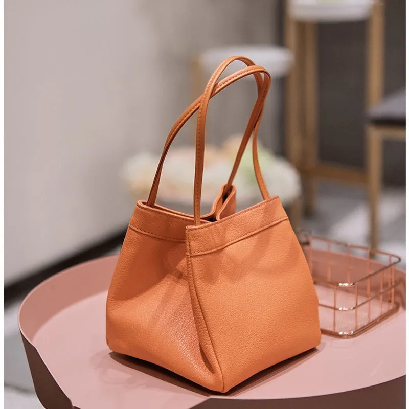 Cute small square bucket bag for women in textured PU, available in six solid colours including green and black.