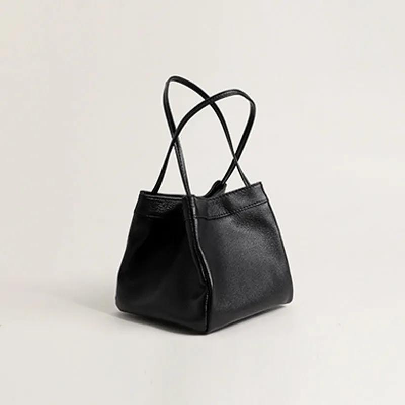 Cute small square bucket bag for women in textured PU, available in six solid colours including green and black.