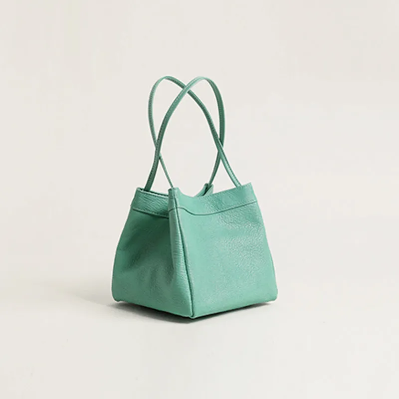 Cute small square bucket bag for women in textured PU, available in six solid colours including green and black.