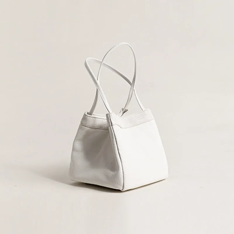 Cute small square bucket bag for women in textured PU, available in six solid colours including green and black.