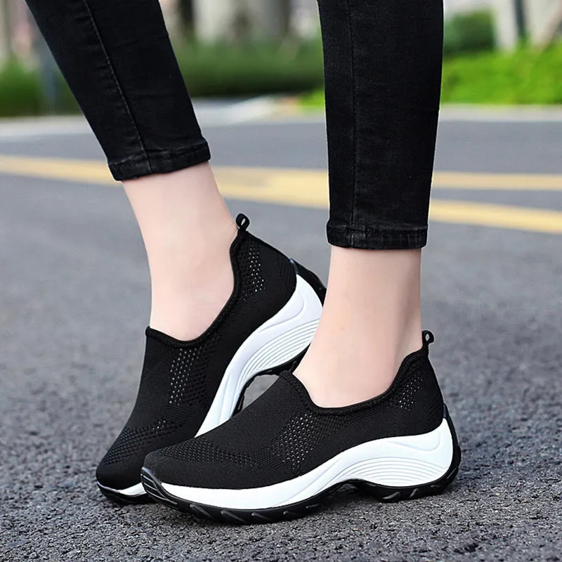 Ladies casual mesh wedge heel platform shoes in black, side view showing hollow mesh upper and round toe