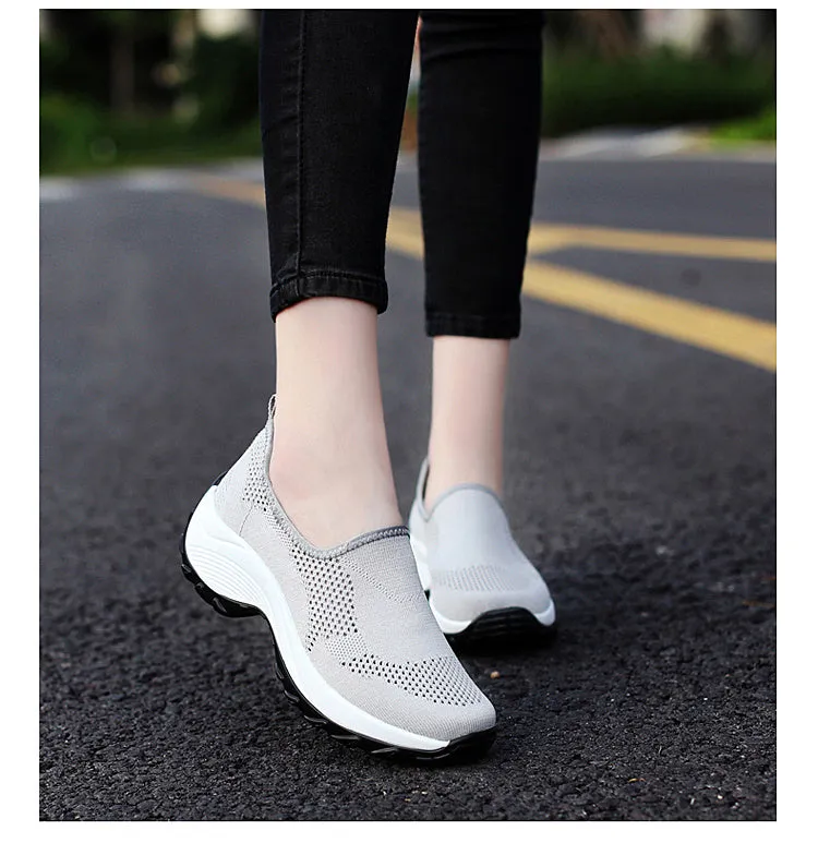 Ladies casual mesh wedge heel platform shoes in black, side view showing hollow mesh upper and round toe