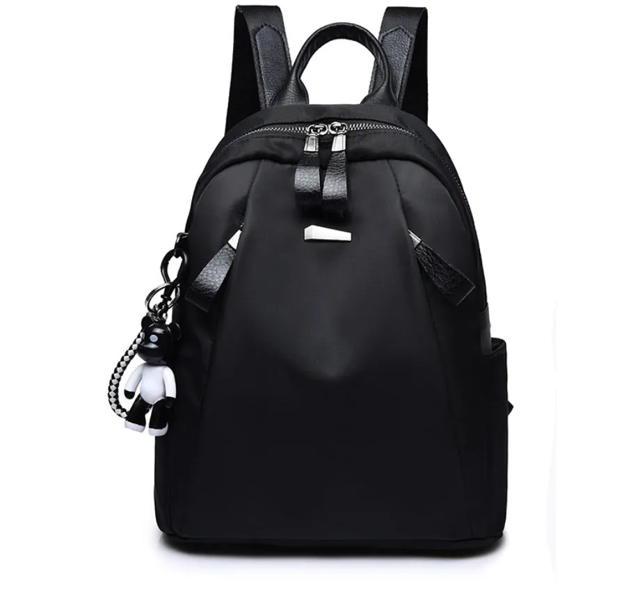 Medium square Oxford cloth rucksack in wine red with double straps and a front patch pocket.